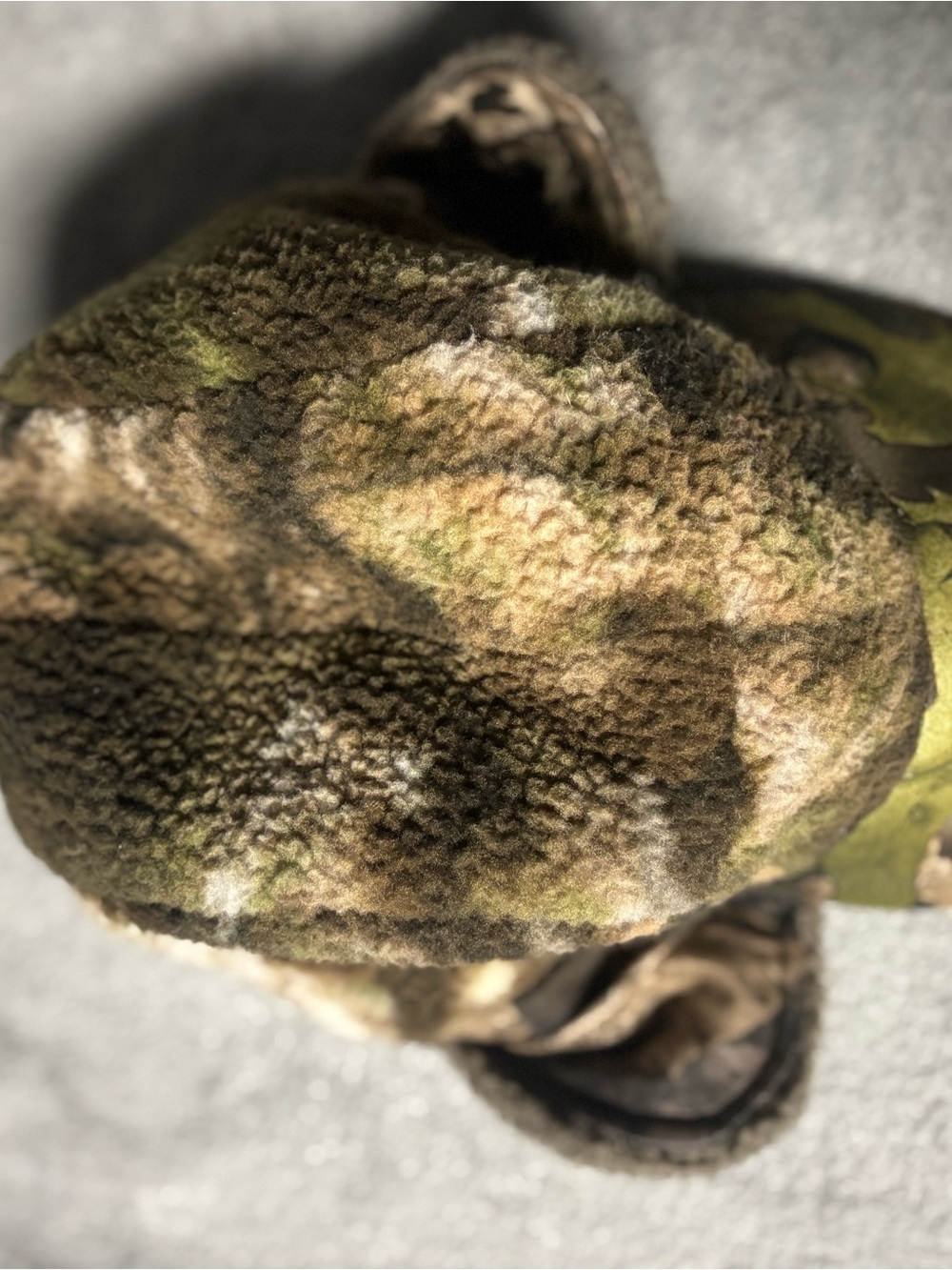 Nomad Harvester camo billed beanie made of Berber fleece.